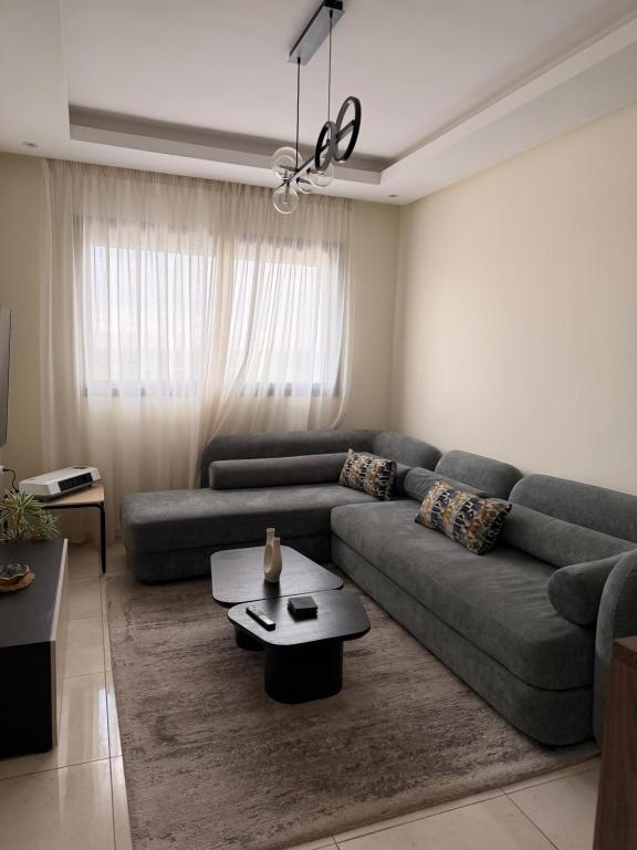 Area soggiorno di Appartement moderne avec piscine, 2 chambres