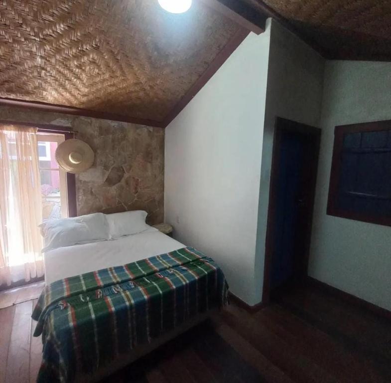 a bedroom with a bed in a room at Suíte - Casa Rodante in Ouro Preto