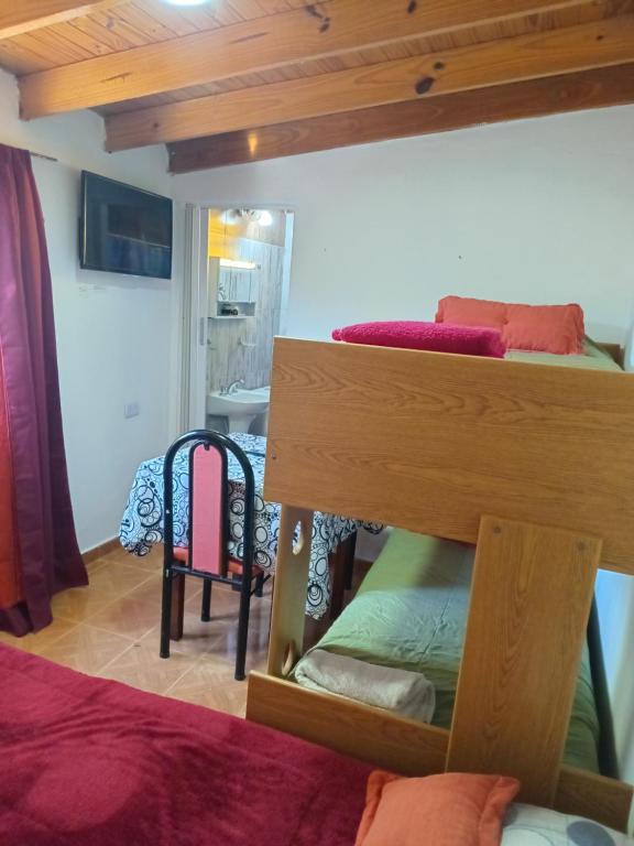 a room with two bunk beds in a room at Dormis in Perito Moreno