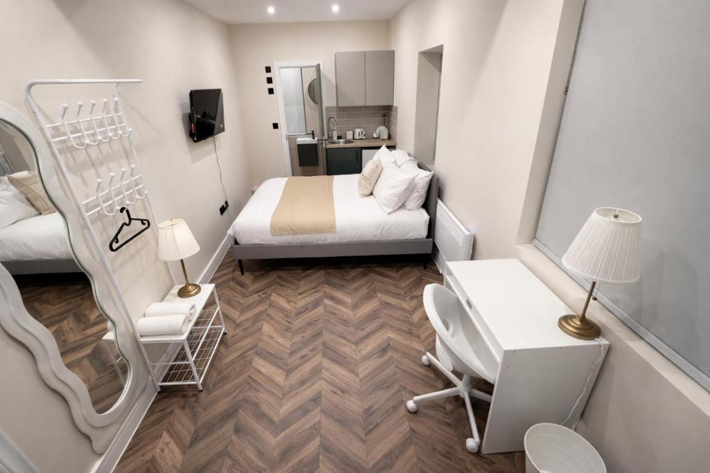 En eller flere senge i et værelse på Stylish Studios 20 min train to Central London