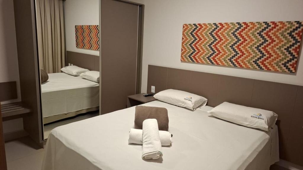 En eller flere senge i et værelse på Apartamentos Veredas Park - Rio Quente Goias