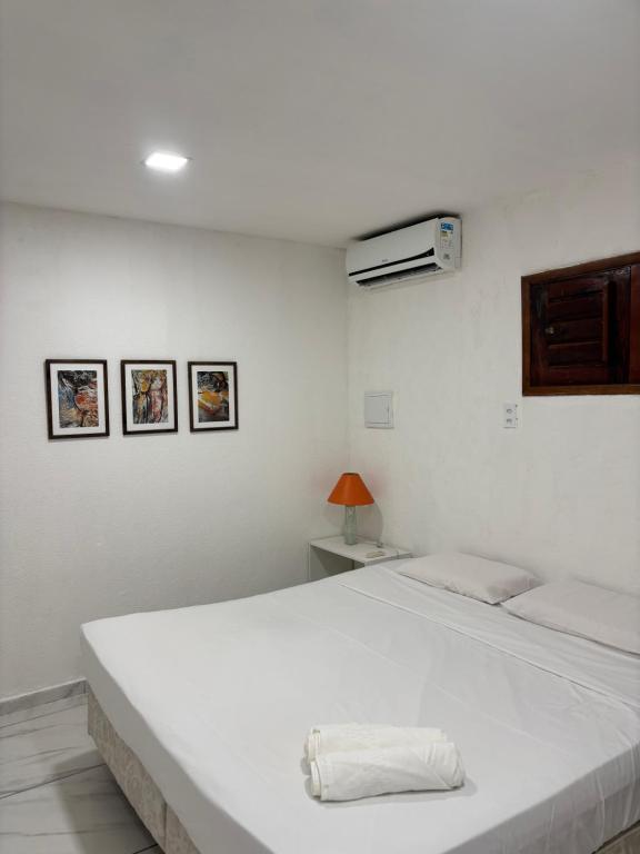 En eller flere senge i et værelse på Suites Premium Jacarey, Fortaleza