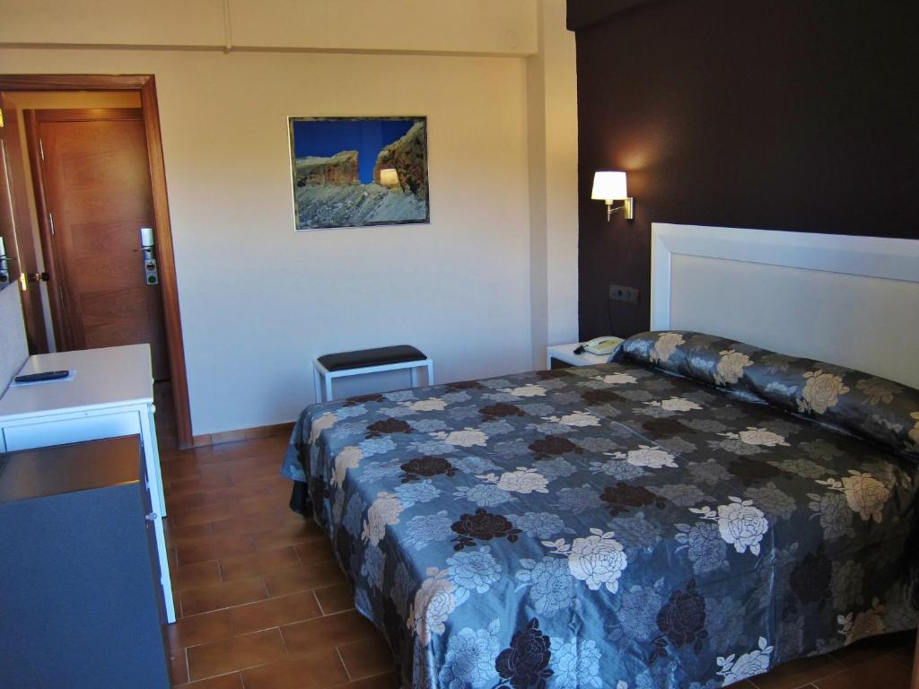 Postel nebo postele na pokoji v ubytování Hotel Meson de L’Ainsa