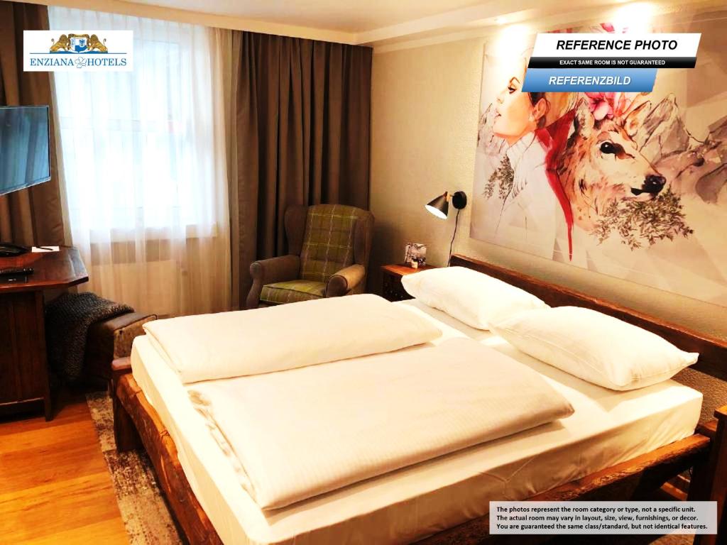 Giường trong phòng chung tại Hotel Enziana Wien