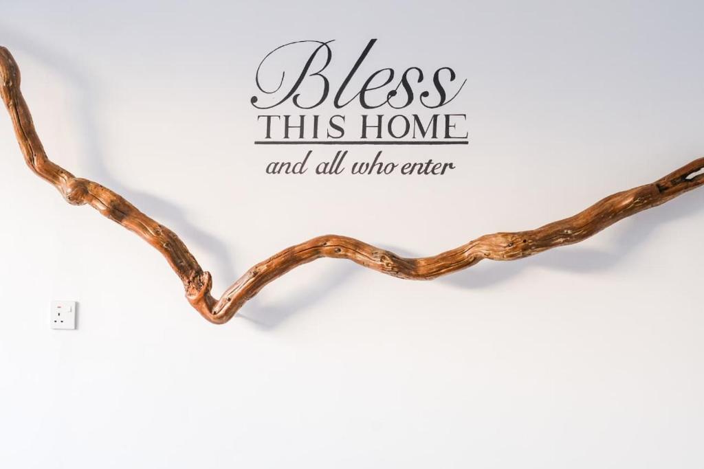 a heart made out of copper wire with bless this home and all who enter at Danka Luxury Villa in Batam Center
