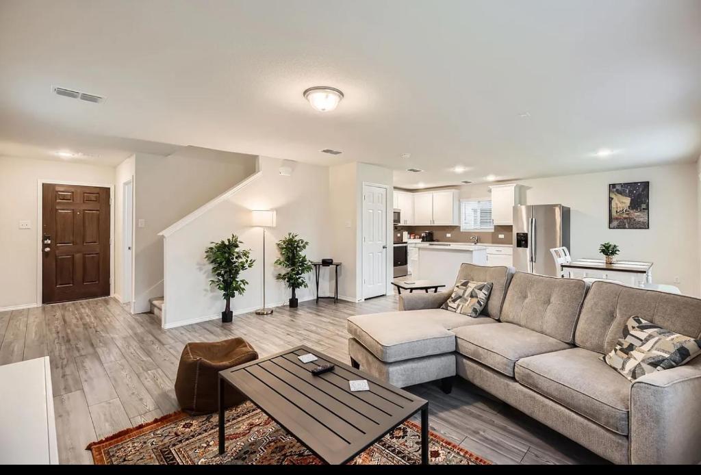 a living room with a couch and a table at Modern Retreat with Private Office in Heath
