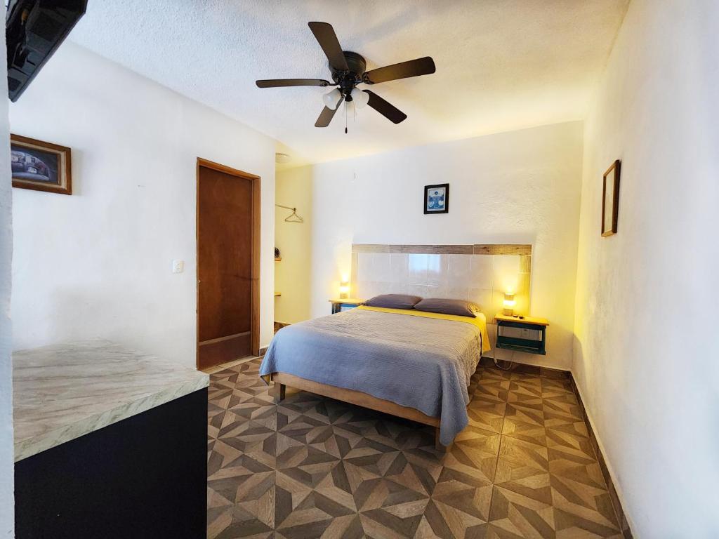 En eller flere senge i et værelse på Hacienda San Miguel