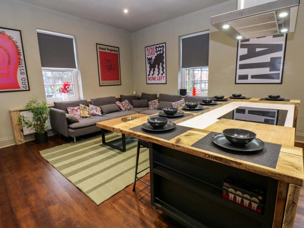 a kitchen and living room with a table with bowls on it at Chalet 86 in North Shields
