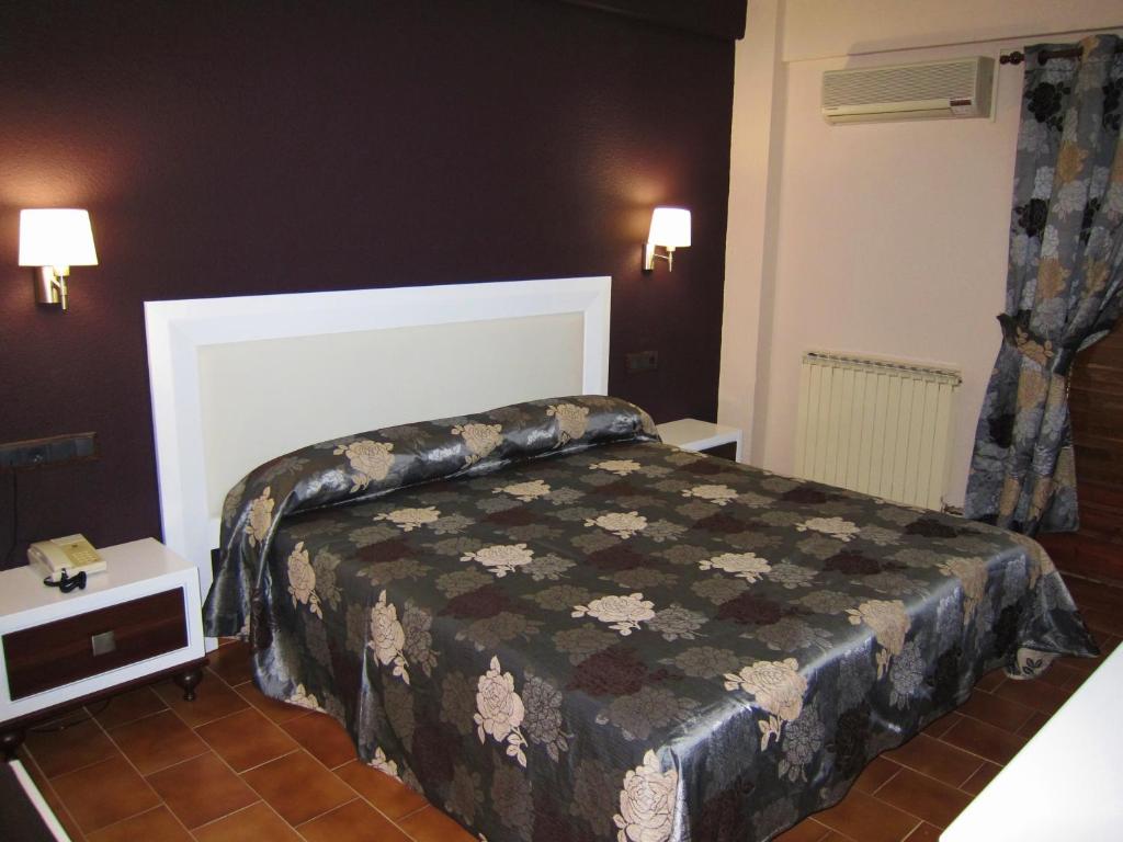 Postel nebo postele na pokoji v ubytování Hotel Meson de L’Ainsa
