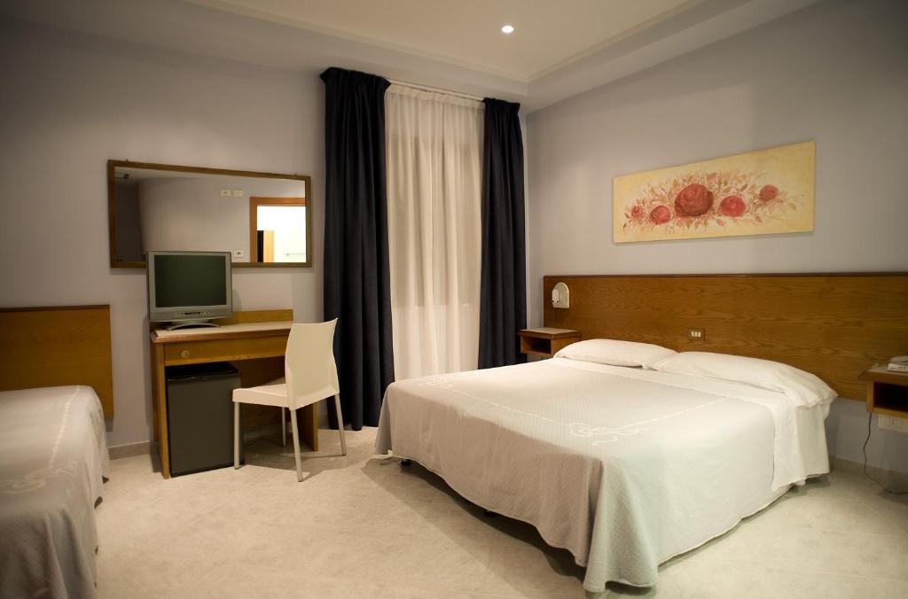 Postel nebo postele na pokoji v ubytování Hotel Sirio
