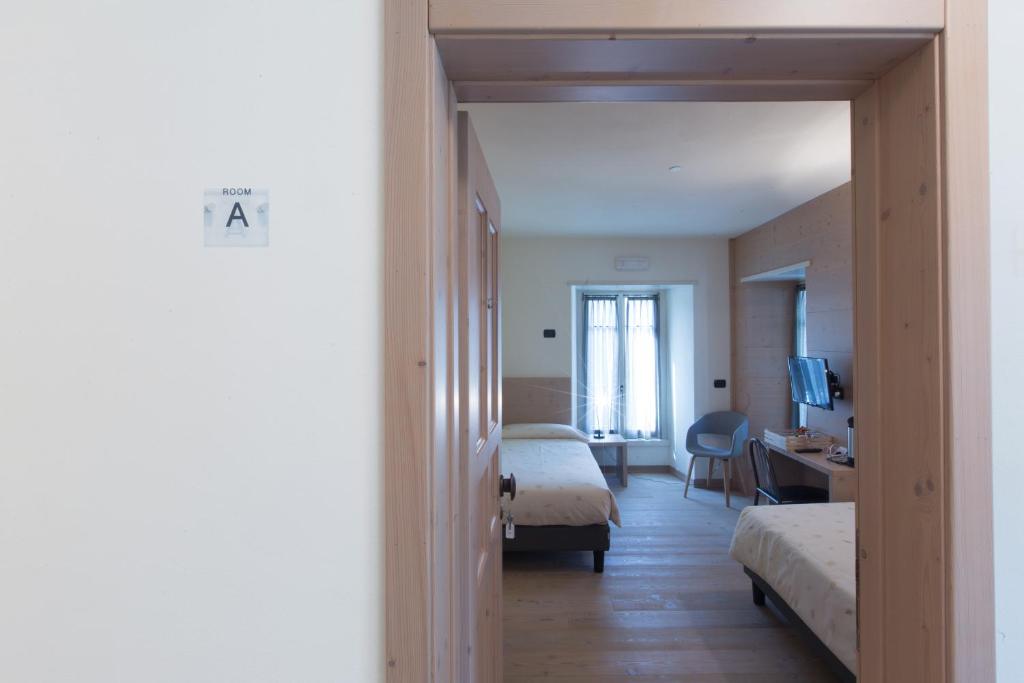 Postel nebo postele na pokoji v ubytování Marzia Rooms