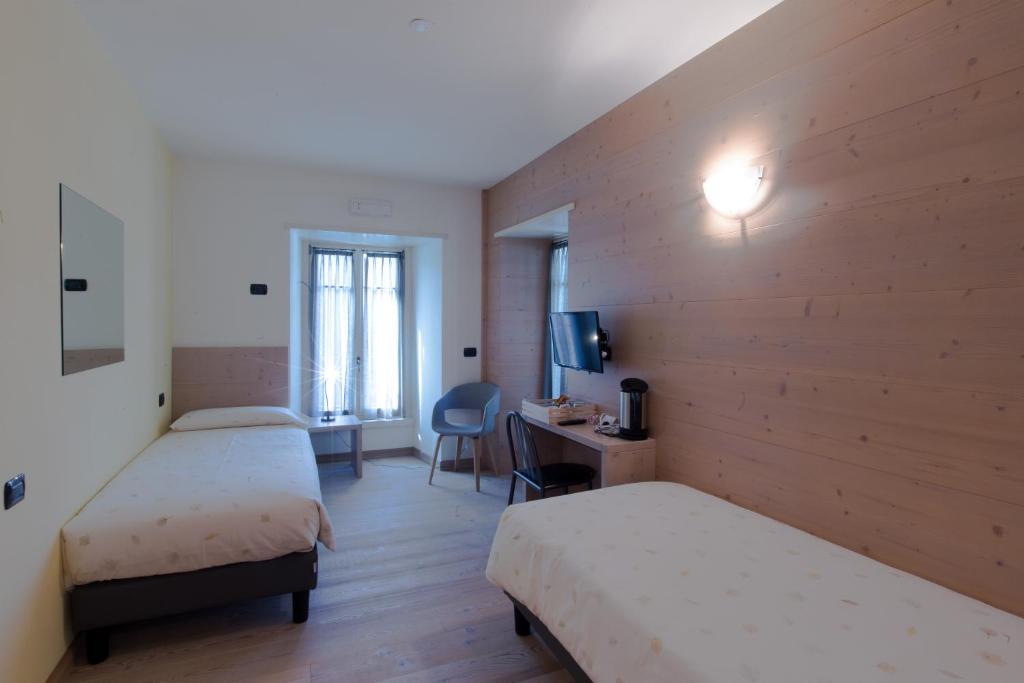 Postel nebo postele na pokoji v ubytování Marzia Rooms