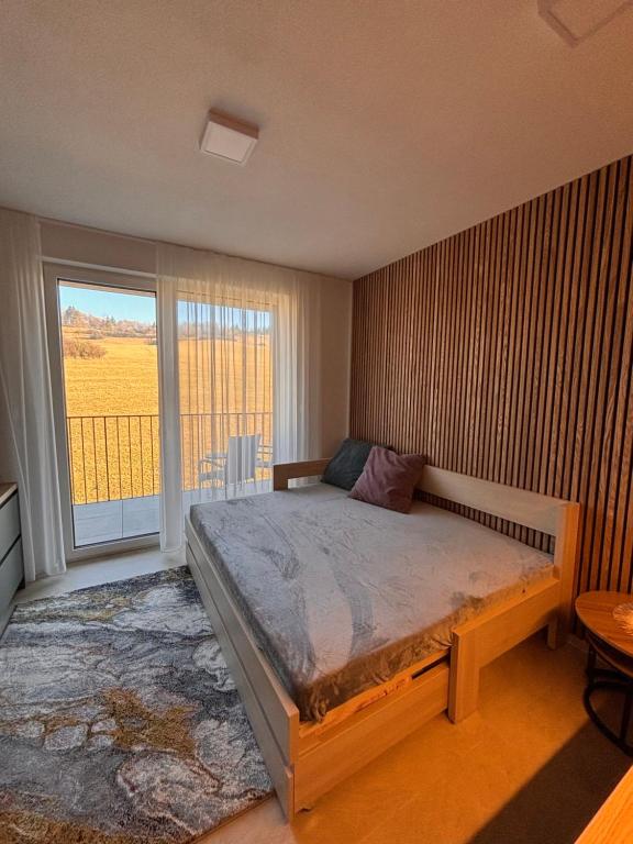 Postel nebo postele na pokoji v ubytování Apartmán nad Dolným Kubínom