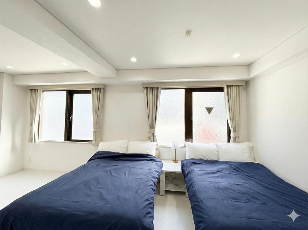 Giường trong phòng chung tại Hotel LEAP