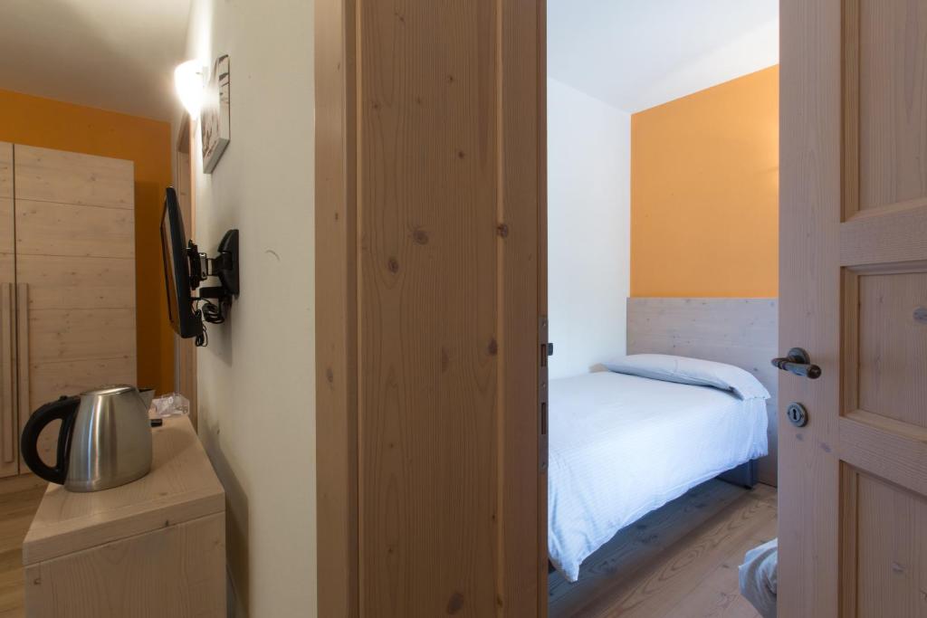 Postel nebo postele na pokoji v ubytování Marzia Rooms