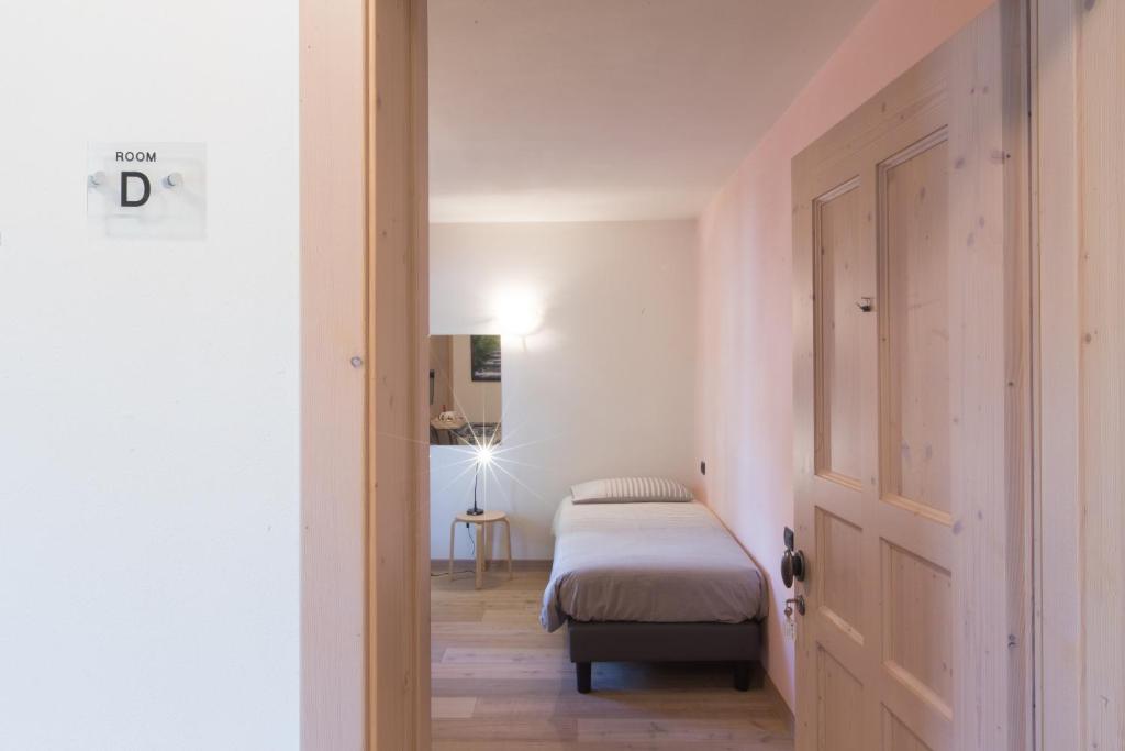 Postel nebo postele na pokoji v ubytování Marzia Rooms