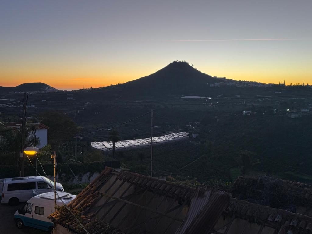 a view of a mountain at sunset with a van at Furgoneta camper solo hospedaje sin conducción in Trapiche