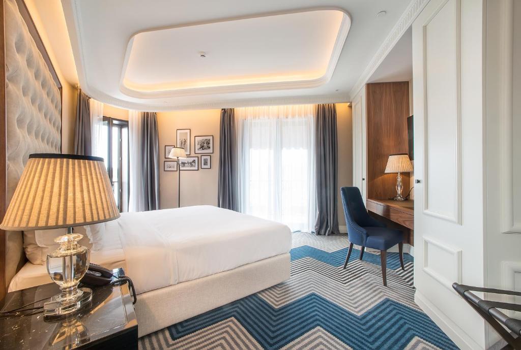 Postel nebo postele na pokoji v ubytování Boutique Hotel La Roche
