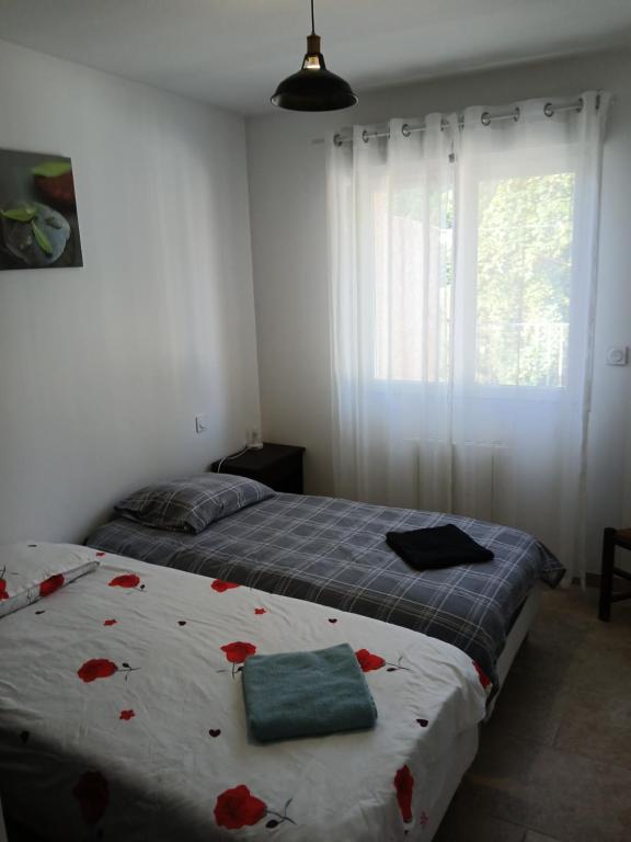 Postel nebo postele na pokoji v ubytování La maison calme