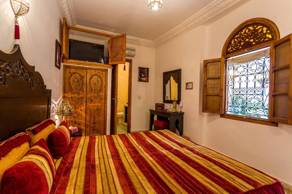 Postel nebo postele na pokoji v ubytování Riad Mouna