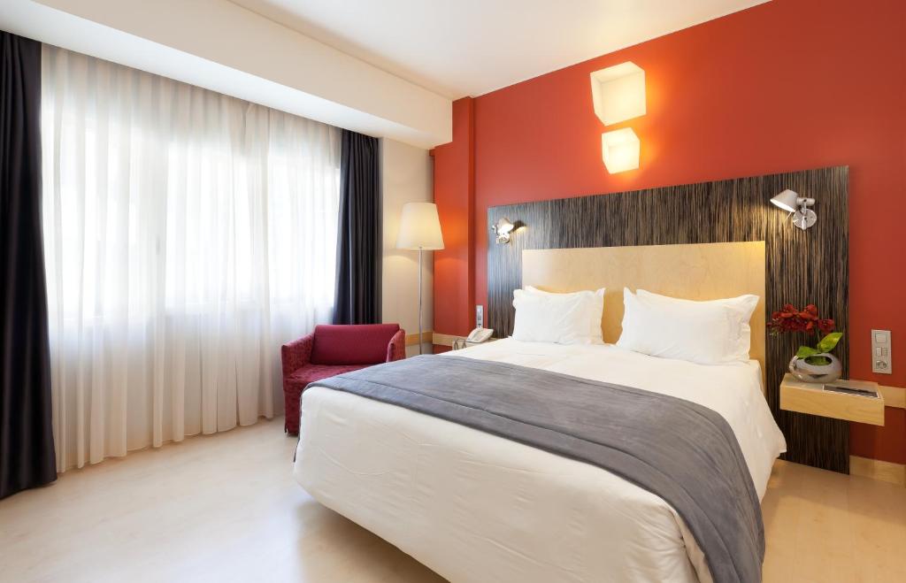 Postel nebo postele na pokoji v ubytování Hotel Alif Avenidas