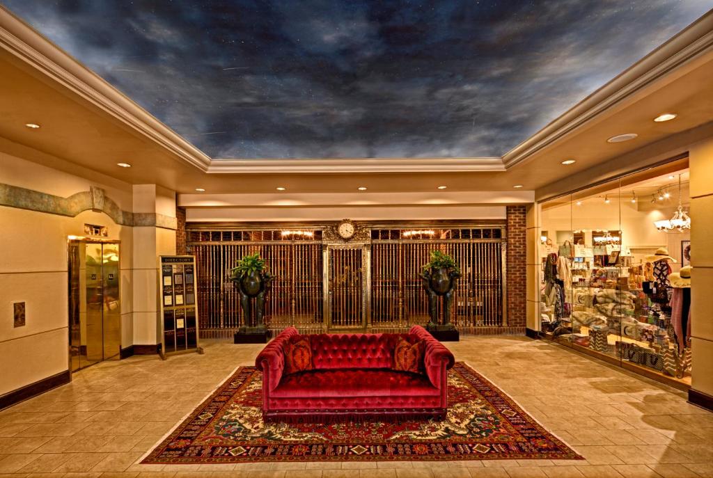 a red couch in a room with a store at Carnegie Hotel & Spa in Johnson City