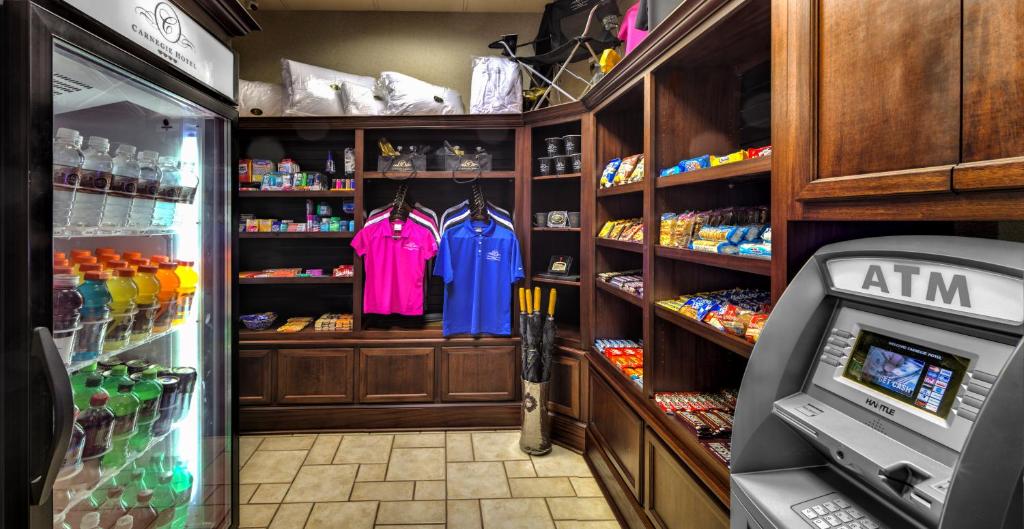 a store room with a refrigerator and shirts on shelves at Carnegie Hotel & Spa in Johnson City