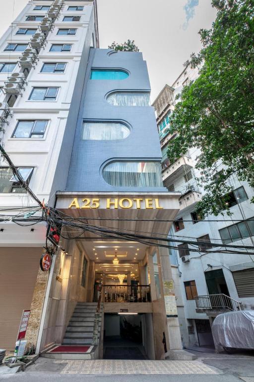 a building with a sign that reads aos hotel at A25 Hotel - 63A Phương Liệt in Hanoi