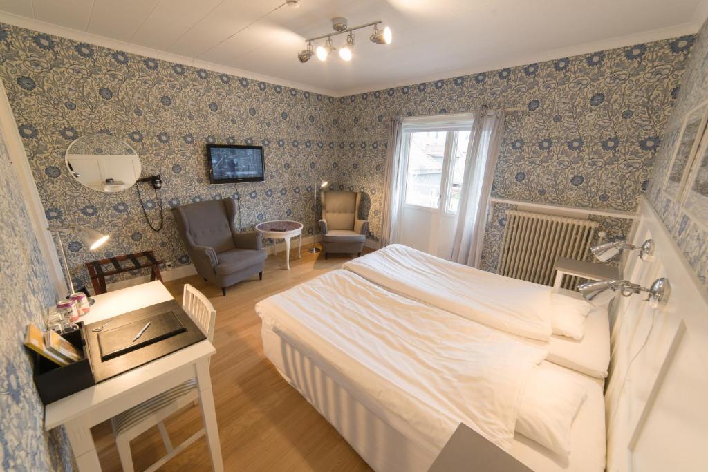 Postel nebo postele na pokoji v ubytování Hotell Stensborg