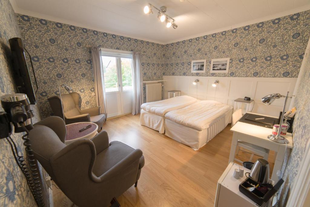 Postel nebo postele na pokoji v ubytování Hotell Stensborg