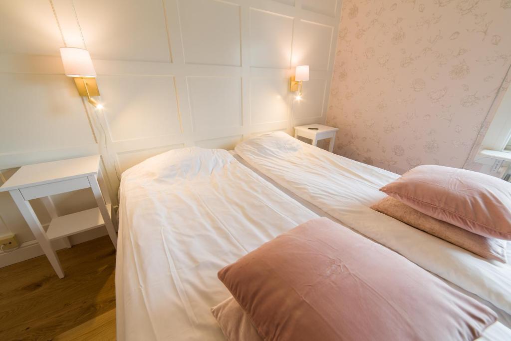 Postel nebo postele na pokoji v ubytování Hotell Stensborg