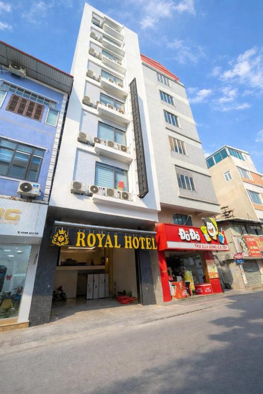 a tall building with a royal hotel on a street at Royal Hotel Hà Nội in Hanoi