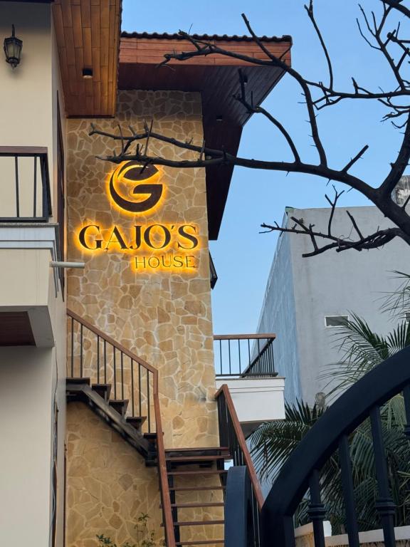 a sign for a casos house on a building at GAJOs HOUSE in Thanh Xuân