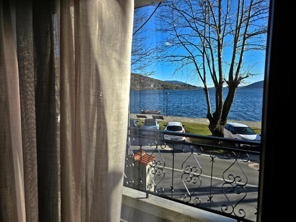 a window with a view of a body of water at 2Steps to the Lake in Kastoria