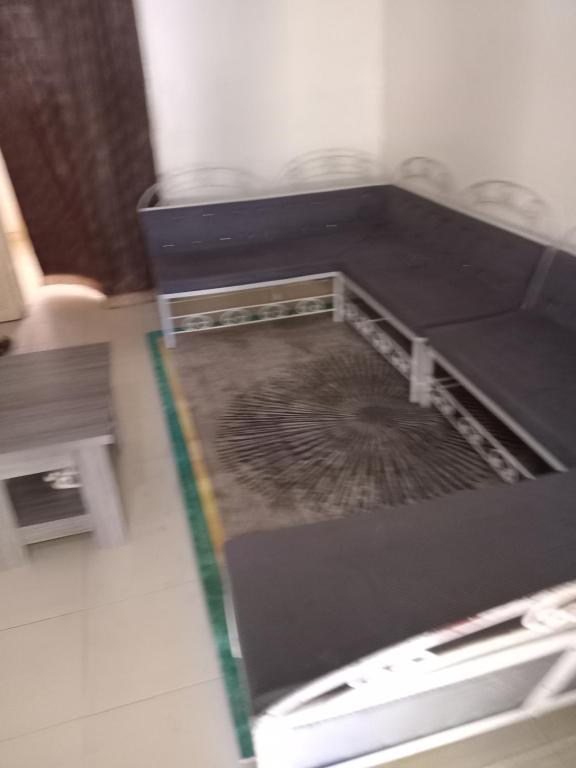 En eller flere senge i et værelse på Hôtel la Rèsidence de la mairie de Mèckhe