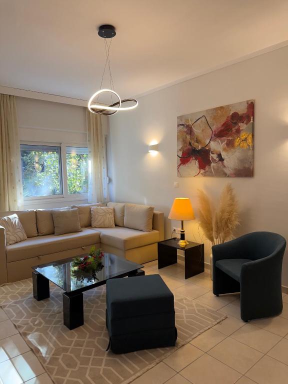 a living room with a couch and a table at The Allatini project Thessaloniki- Part of P STAYS COLLECTION in Thessaloniki