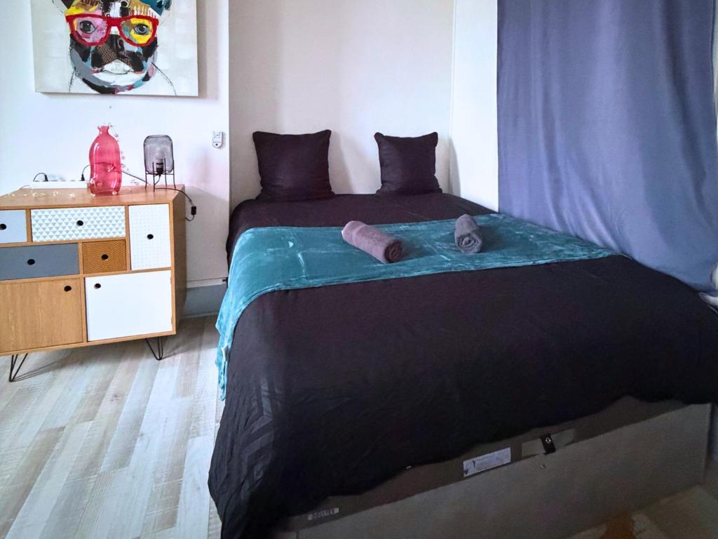 En eller flere senge i et værelse på Le Nexus