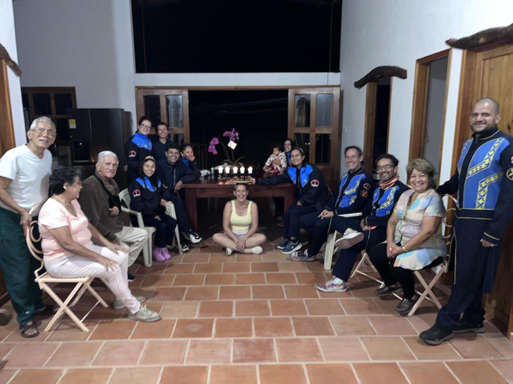 a group of people posing for a picture with a man in uniform at Suelo Vivo Eco Hotel in Bochalema