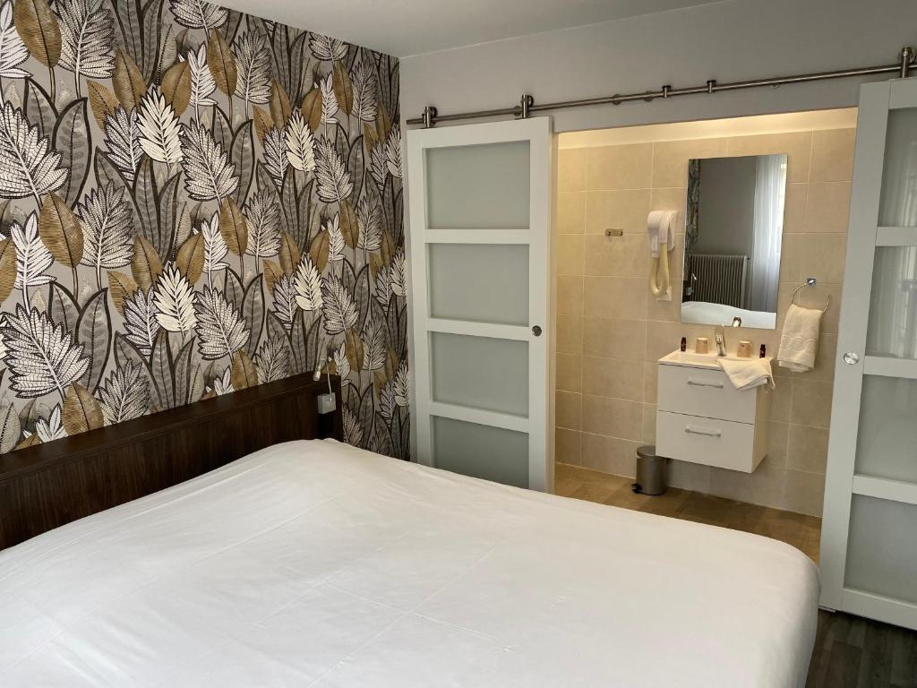 Giường trong phòng chung tại Hôtel Restaurant l'Annexe