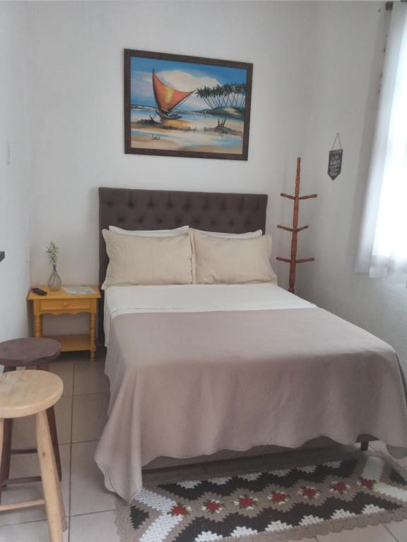 En eller flere senge i et værelse på Apartamento perto do Palácio de Cristal