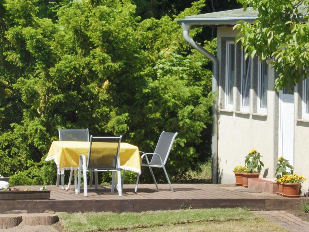 a table and chairs sitting on a patio at Holiday Home mit Pool by Interhome in Radewege