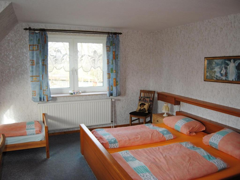 a bedroom with two beds and a window at Apartment Schule 5 by Interhome in Windeby