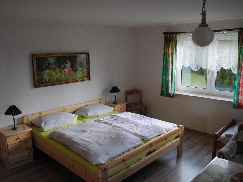 a bedroom with a bed and a window at Apartment Schule 4 by Interhome in Windeby