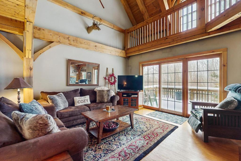 a living room with a couch and a table at Grouse Lane 12C in Dover