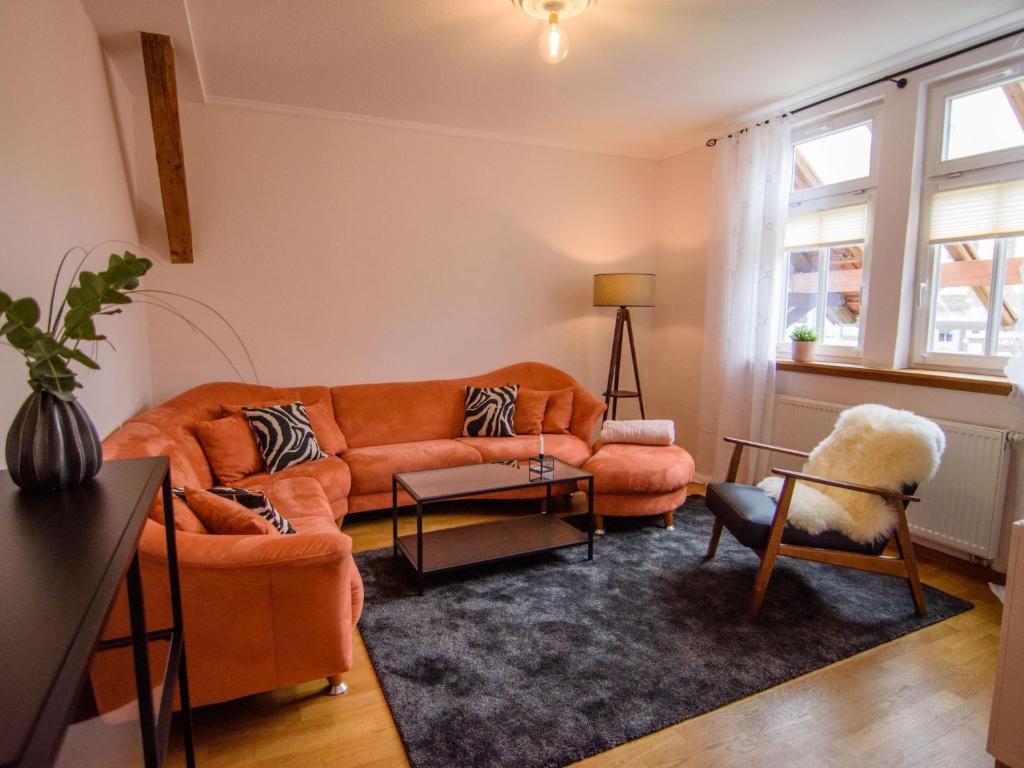 a living room with a couch and a chair at Apartment Appartement mit Terrasse by Interhome in Bracht