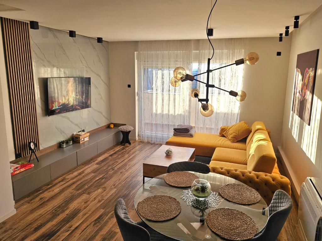 a living room with a couch and a table at Leotar View Apartment in Trebinje
