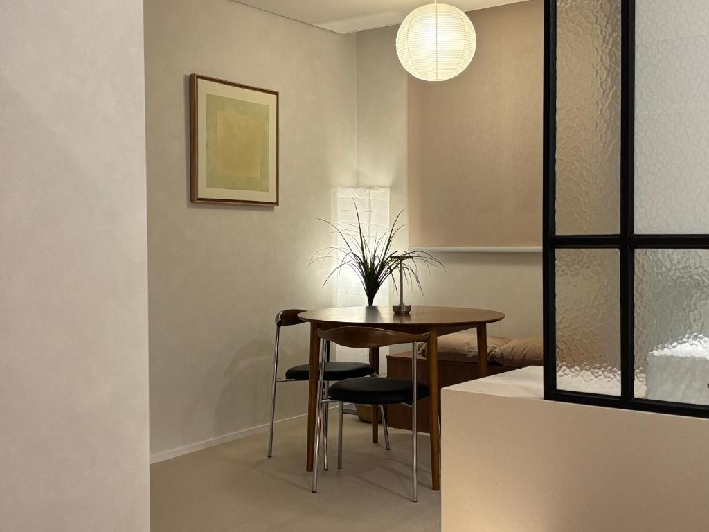 a dining room with a table and chairs at 무무 mumu in Seoul