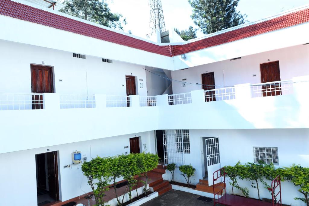 a view of the outside of a building at Aroma Resort Hill Palace in Kolli Hills