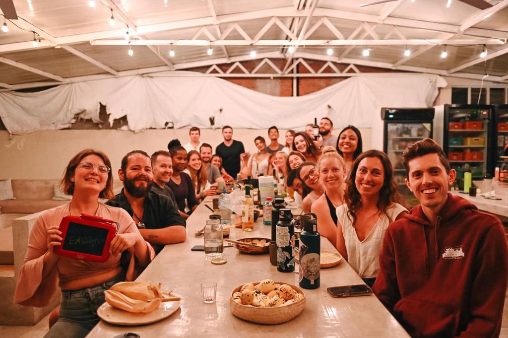 a group of people sitting at a long table at Co404 Oaxaca - Coliving Coworking in Oaxaca City