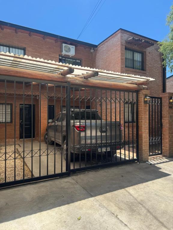 a truck parked behind a gate in a building at Cava del Sur in San Rafael